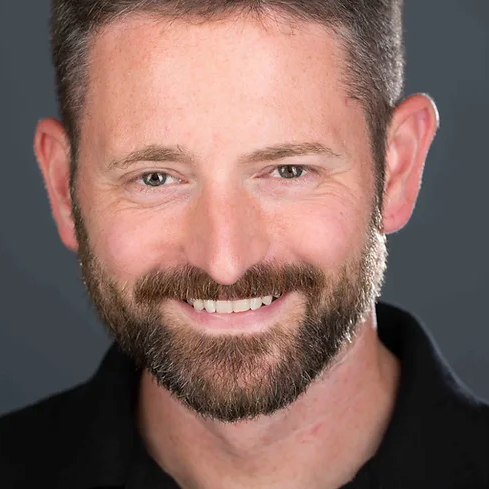 Steve_McCurry seen posing for a photo with a bright smile on his face